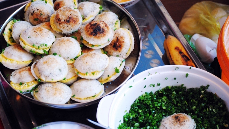 Bánh căn is the traditional dish of the Cham people in Ninh Thuận, poured into special earthen molds...