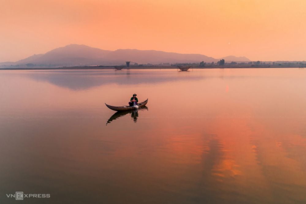 Amidst the poetic Bien Ho Pleiku, a majestic statue of Quan Am Bodhisattva stands on a small hill, c...