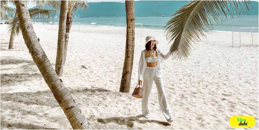 The sand at My Khe is not just white but silky smooth, each step leaving a gentle imprint as if walk...