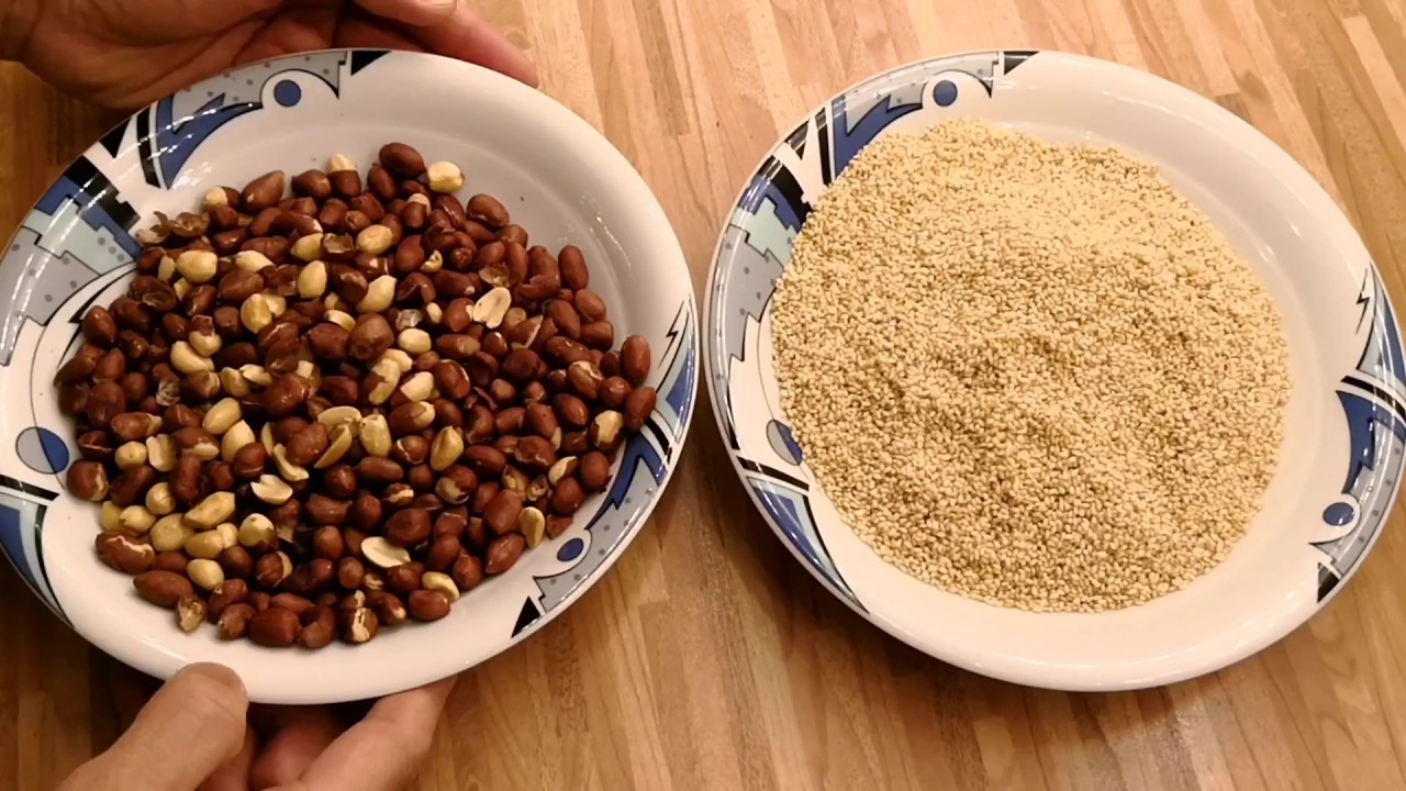 Making Mè Xửng demands patience: sesame and peanuts are toasted until fragrant, sugar is boiled to t...