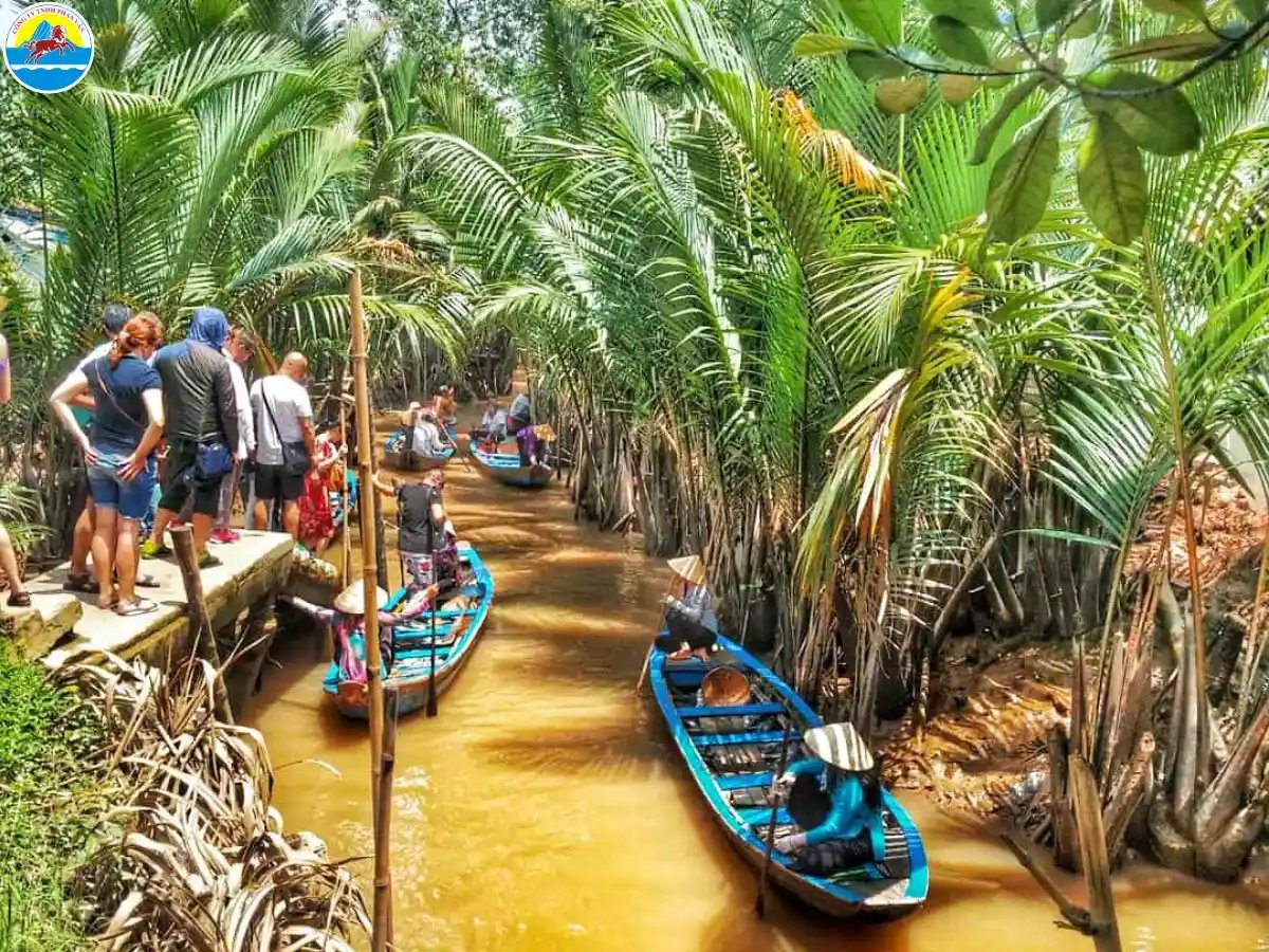 The iconic image of a slender sampan weaving through narrow canals, with two rows of nipa palms form...