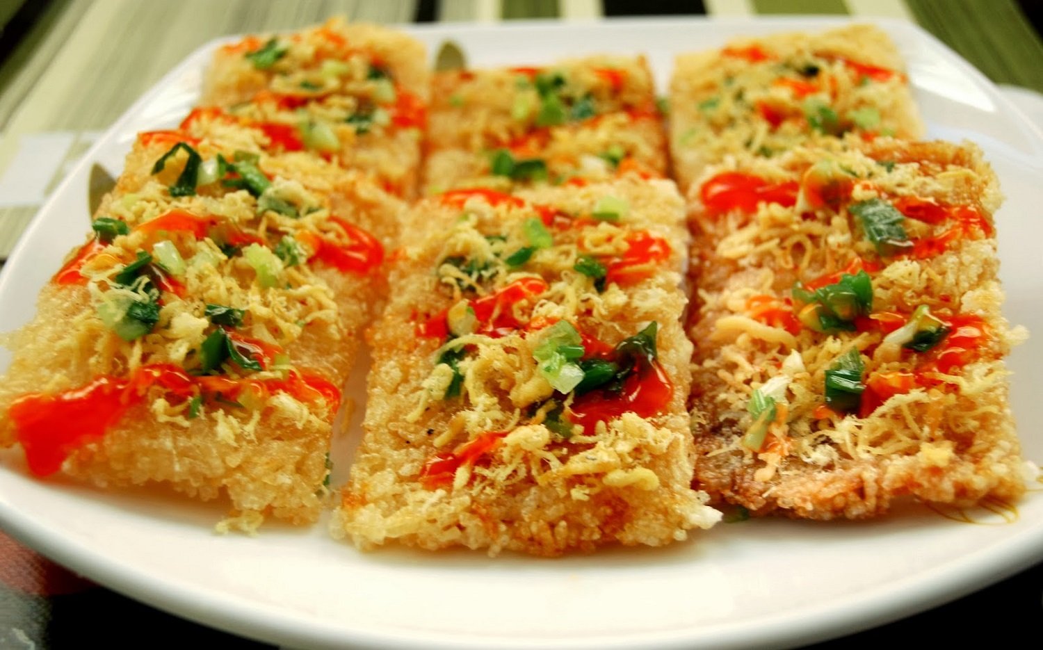 Crafting the perfect crispy rice is an art. The rice must be a blend of sticky and dry varieties, co...