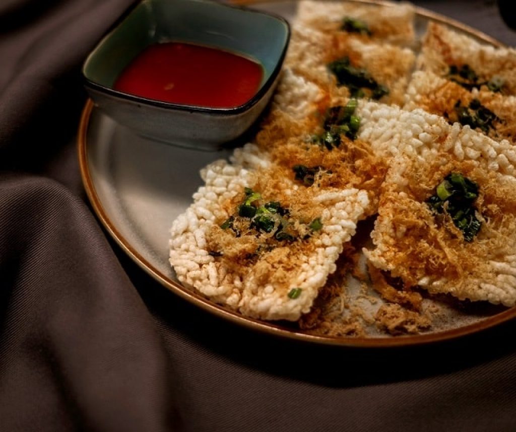 There are diverse and delightful ways to enjoy Ninh Bình Crispy Rice. You can eat it plain to apprec...