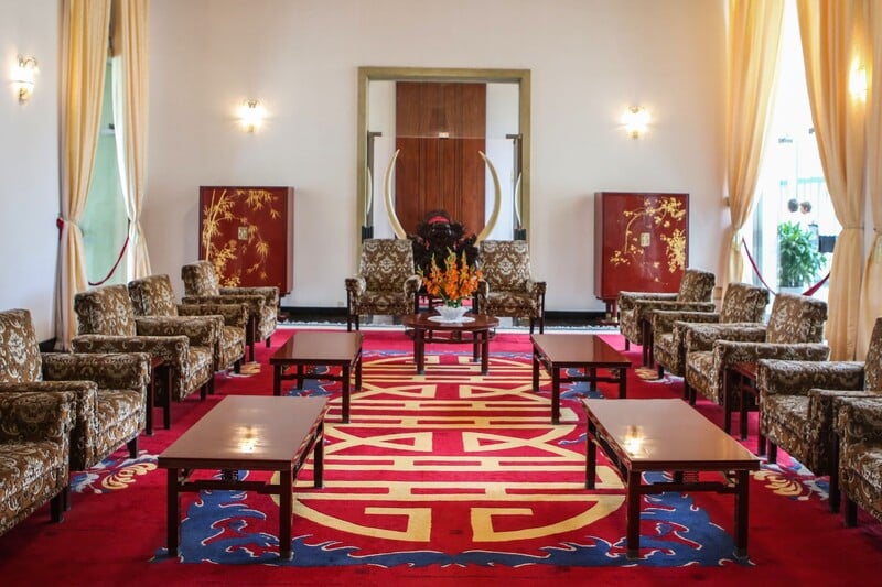 Visitors will continue to explore the Cabinet Meeting Room, where the former regime held regular mee...