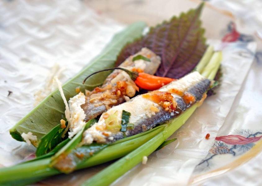 Once prepared, the fish is thoroughly mixed with the ingredients and sour dressing, then topped with...