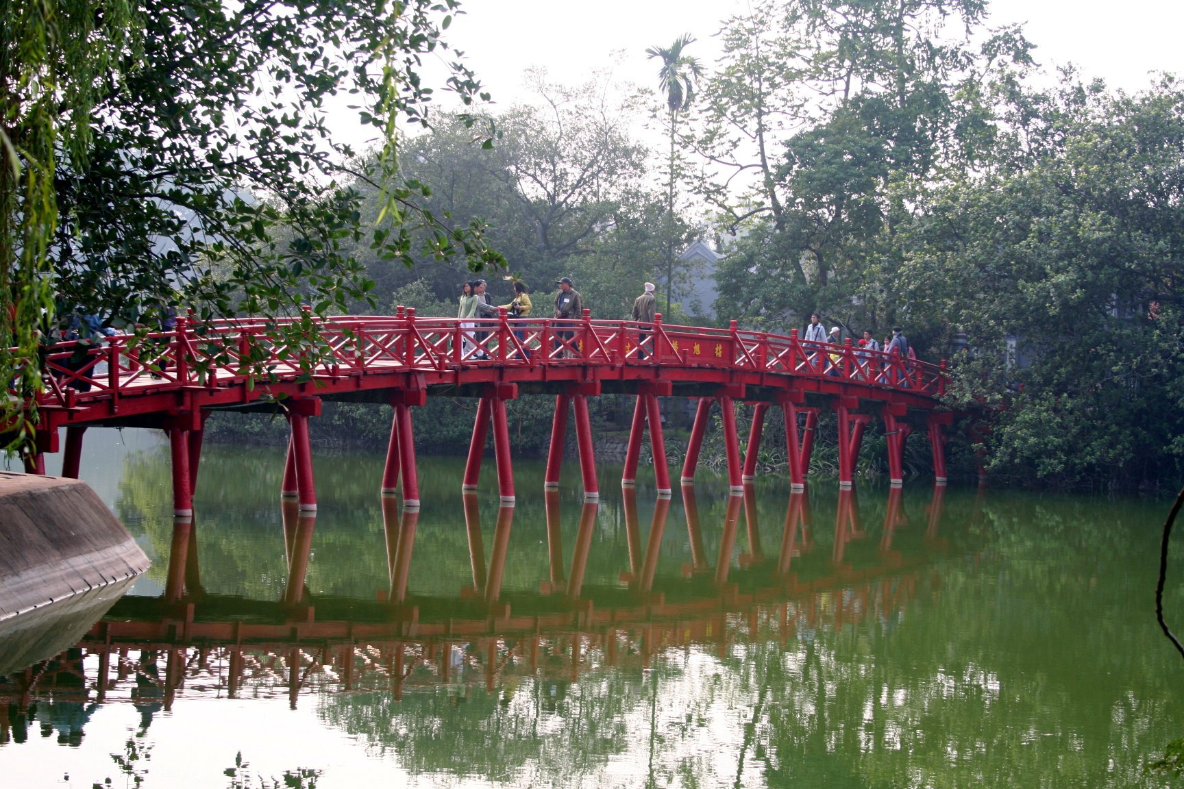 On the northern side of the lake, Ngoc Son Temple stands majestically on Ngoc Son Island, connected ...