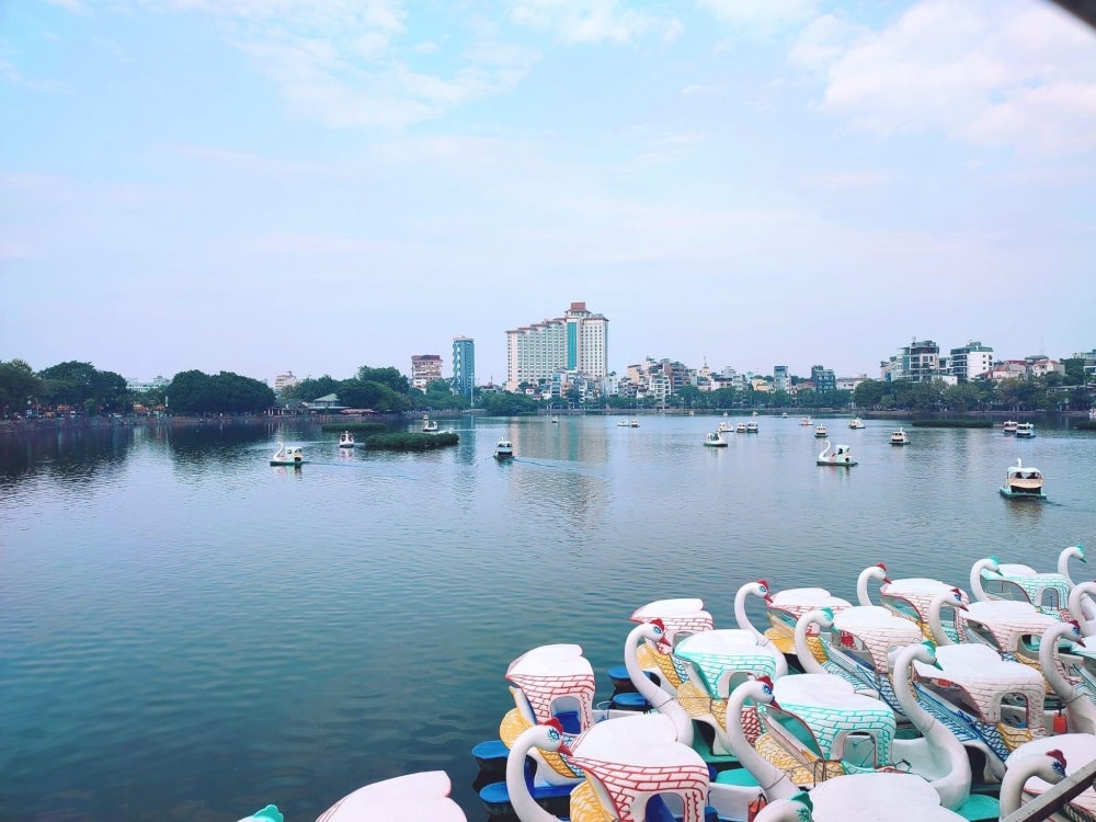 Adjacent to West Lake, Trúc Bạch Lake offers another peaceful experience: a swan pedalo ride. As you...
