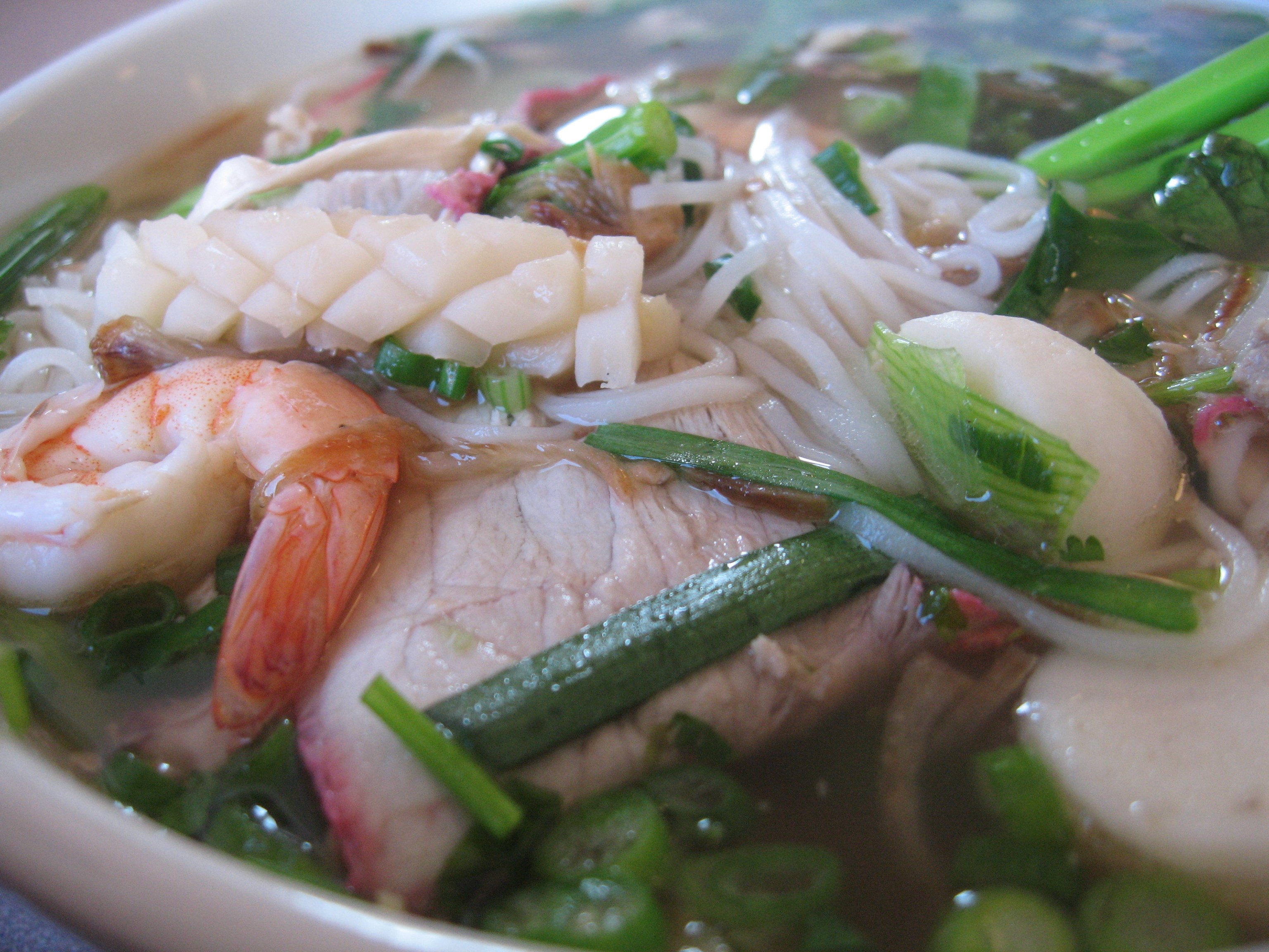 The soul of the dish lies in its distinctive noodles, handmade from the fragrant Gò Cát rice of Mỹ P...