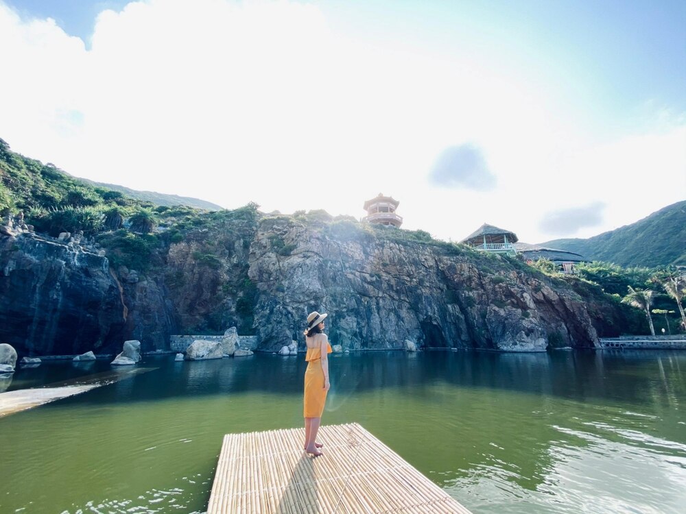 Tucked away among the majestic cliffs on Kỳ Co beach, Hồ Suối Kỳ Co is a small, crystal-clear, and c...