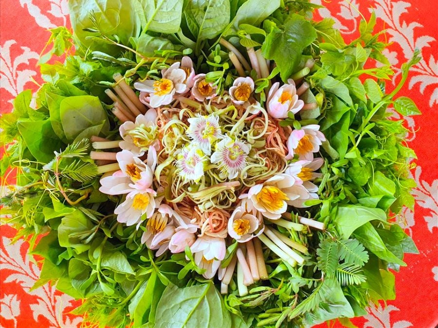 Beyond the fermented base and seafood, Lẩu Mắm U Minh shines with an abundance of fresh wetland vege...