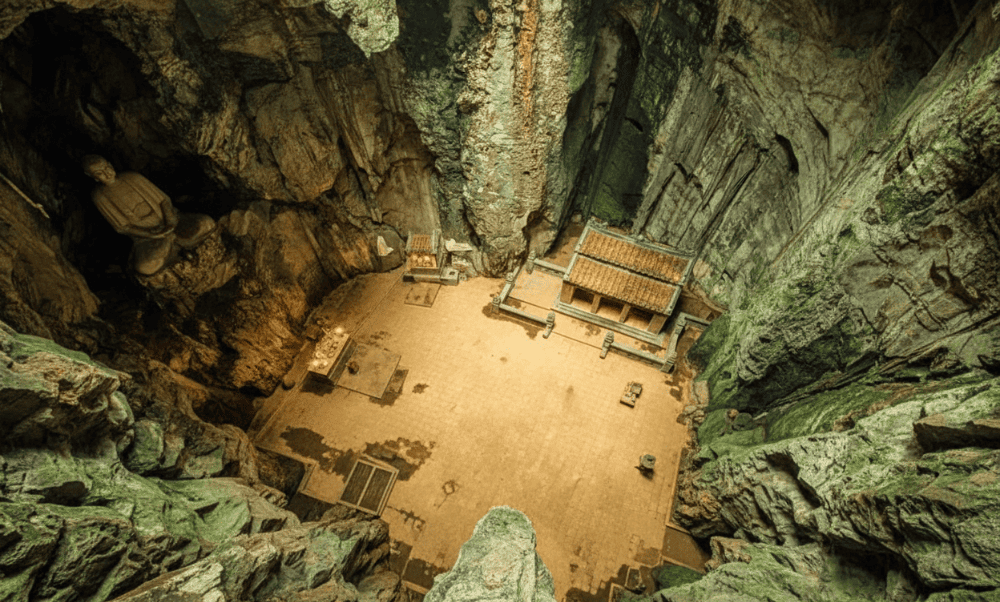 Huyền Không Cave, nestled on the eastern side of Thủy Sơn, is a masterpiece of nature with its circu...