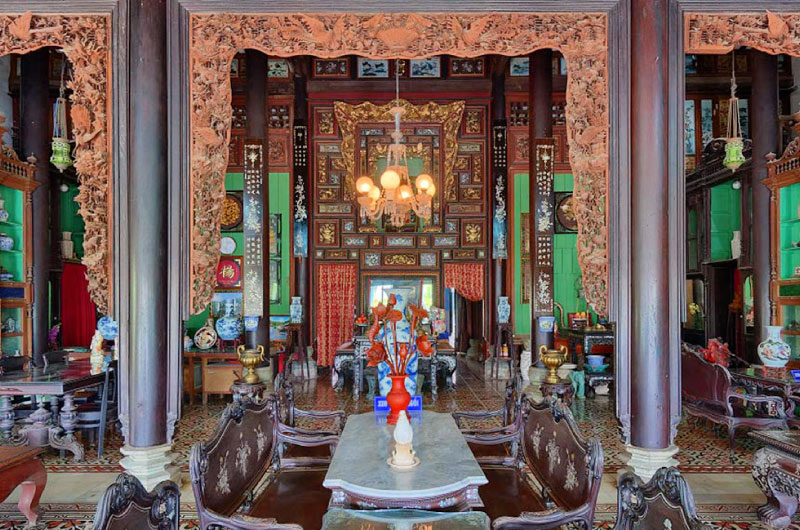 Stepping inside Binh Thuy Ancient House, visitors are captivated by its lavish yet refined interior....