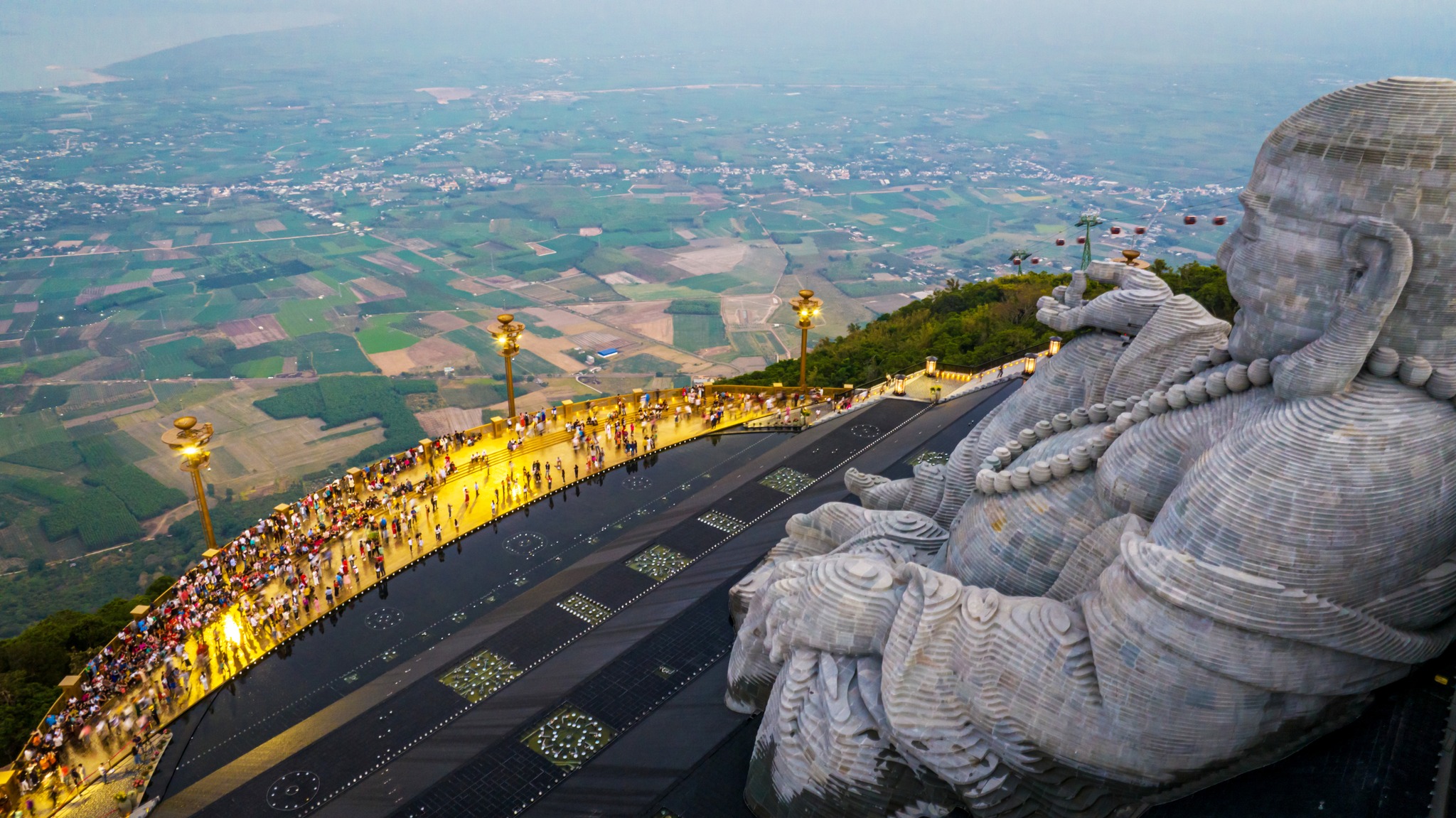 From the mountain peak, the view extends endlessly, embracing the vast Southern plains and the spark...