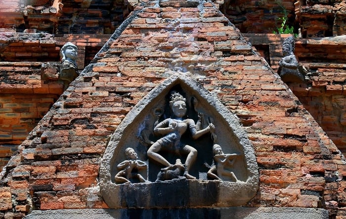 Adorning the tower walls are exquisite bas-reliefs, each a testament to the Champa sculptors' master...